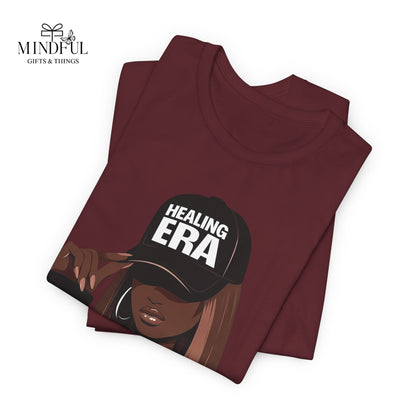 Healing Era Tee — Black Woman Graphic T‑Shirt with 'Healing ERA' Cap Design