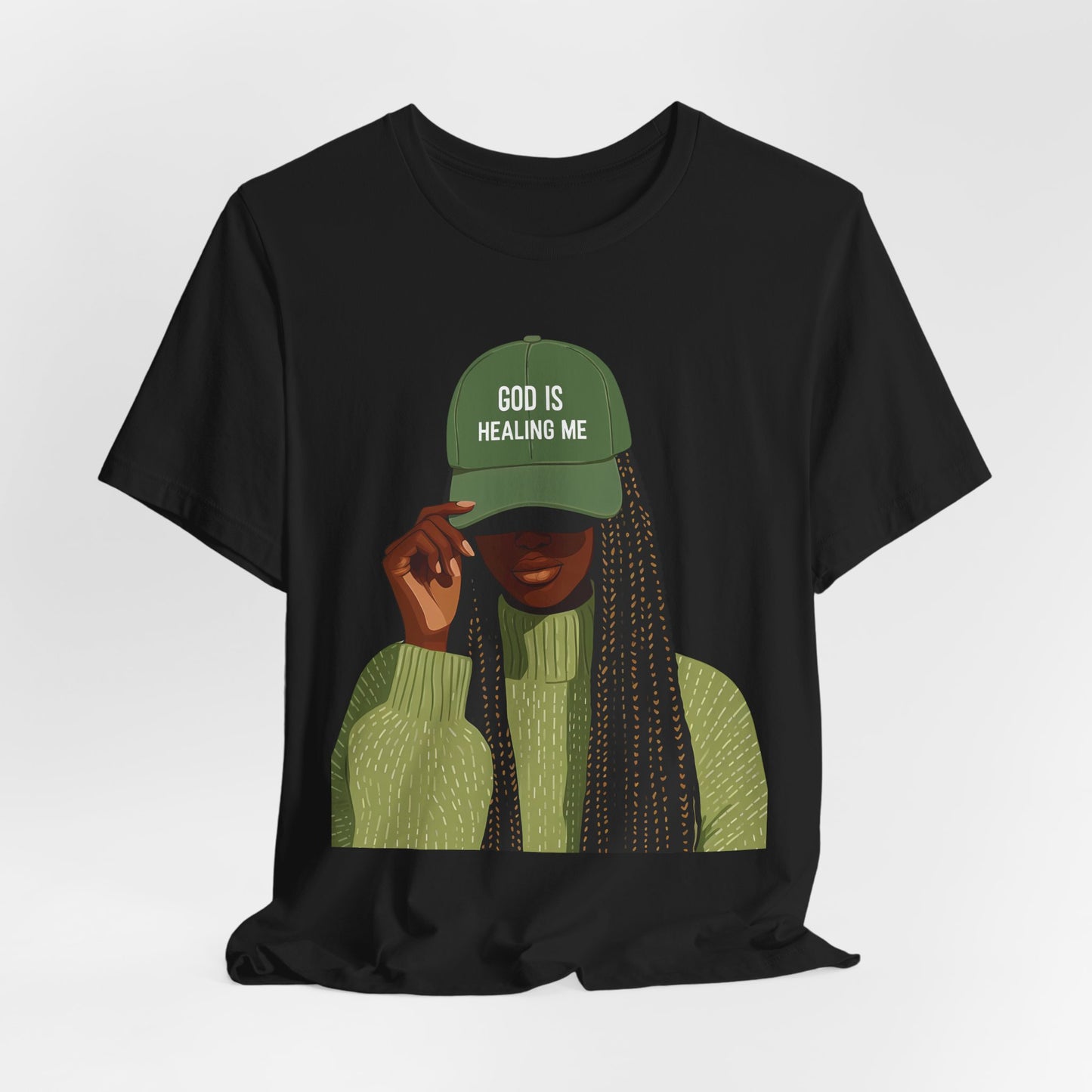 God Is Healing Me Tee — Inspirational Faith T‑Shirt with Green Cap Graphic