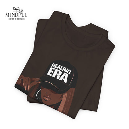 Healing Era Tee — Black Woman Graphic T‑Shirt with 'Healing ERA' Cap Design