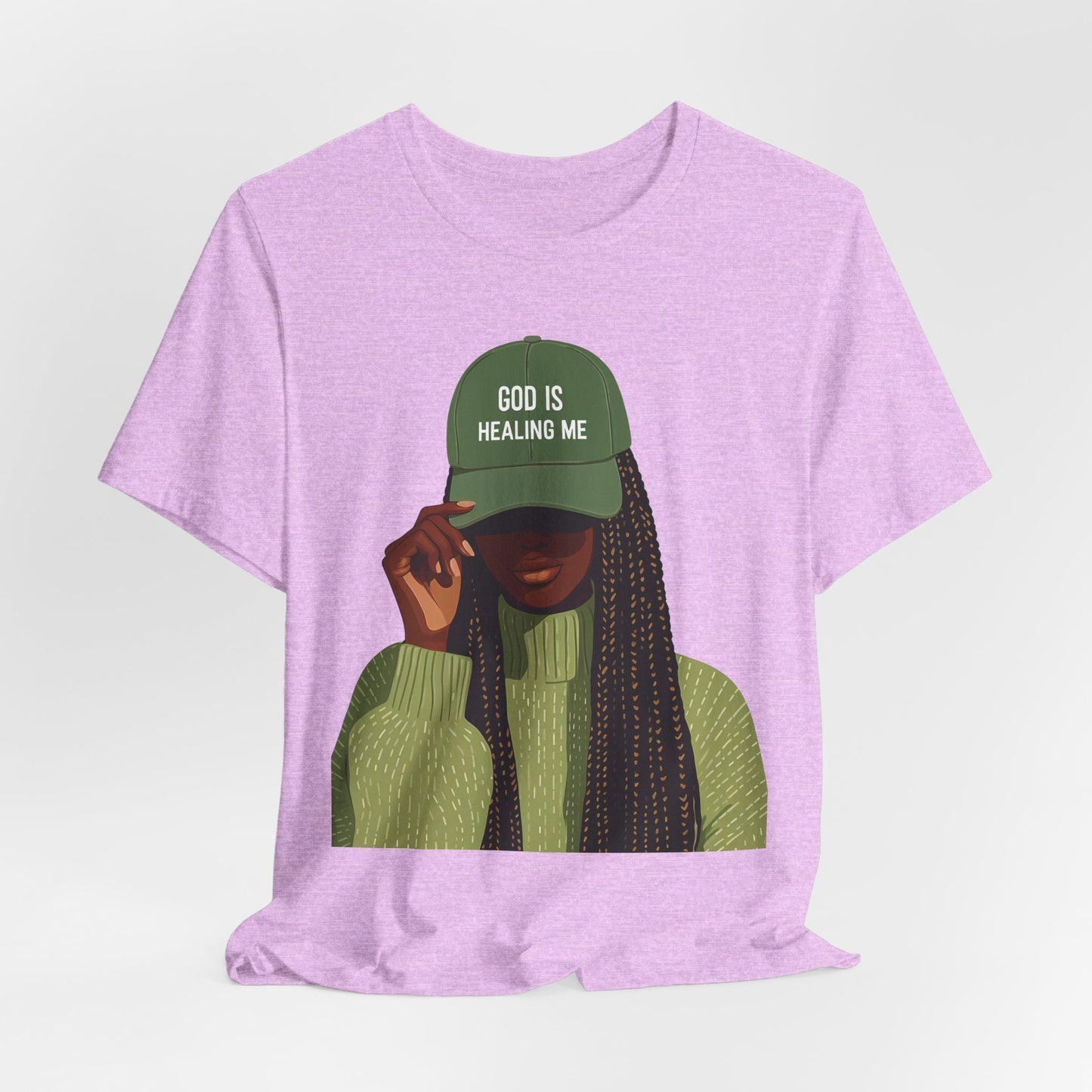 God Is Healing Me Tee — Inspirational Faith T‑Shirt with Green Cap Graphic