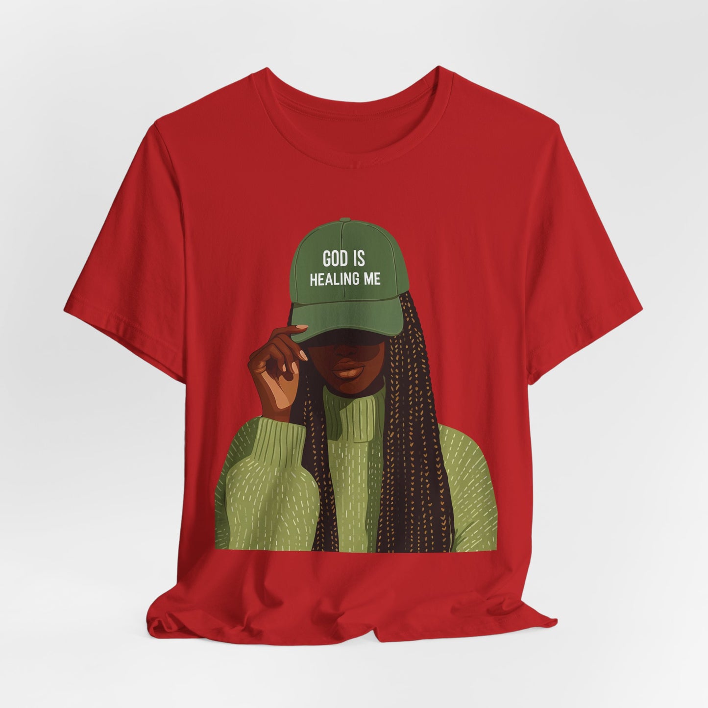God Is Healing Me Tee — Inspirational Faith T‑Shirt with Green Cap Graphic