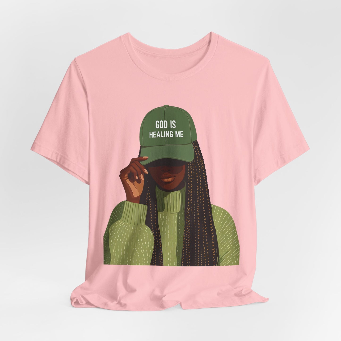 God Is Healing Me Tee — Inspirational Faith T‑Shirt with Green Cap Graphic
