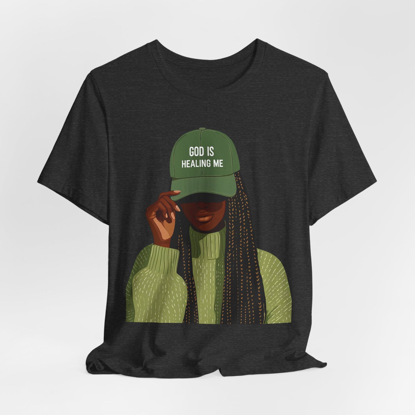God Is Healing Me Tee — Inspirational Faith T‑Shirt with Green Cap Graphic