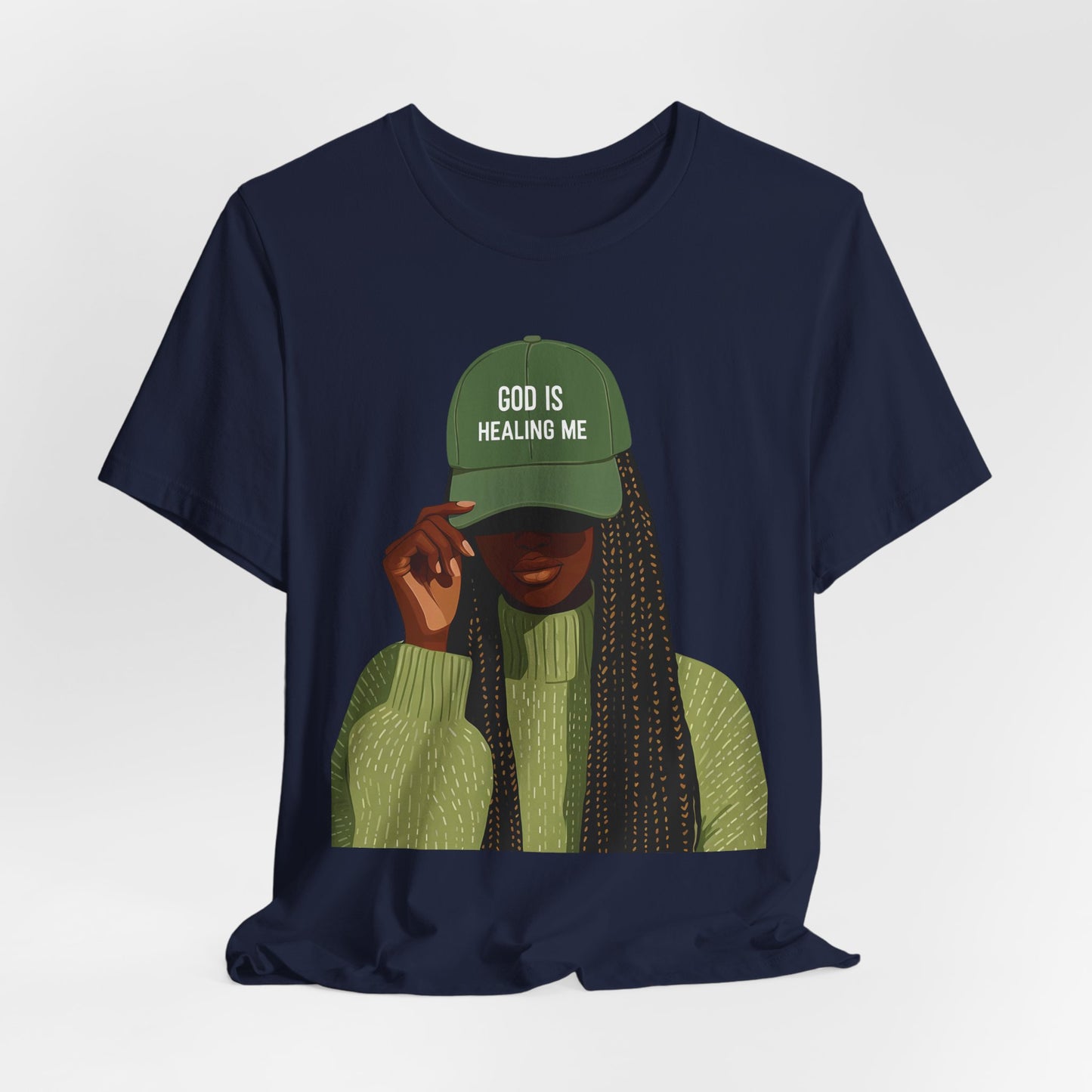 God Is Healing Me Tee — Inspirational Faith T‑Shirt with Green Cap Graphic